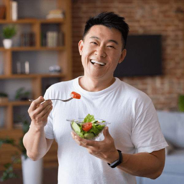 man eating salad, balanced diet