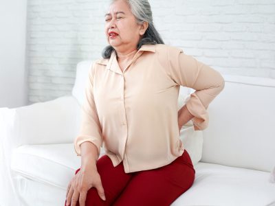 asian-elderly-woman-sitting-sofa-she-had-pain-her-waist-back-hospital-concept-degenerative-spinal-system-elderly-retirement-health-care-02